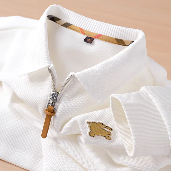 Embellished with a distinctive golden rabbit emblem on the chest